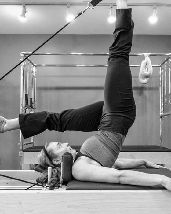 Jolene Callahan working on the reformer in the Big Sky Fitness Fusion studio